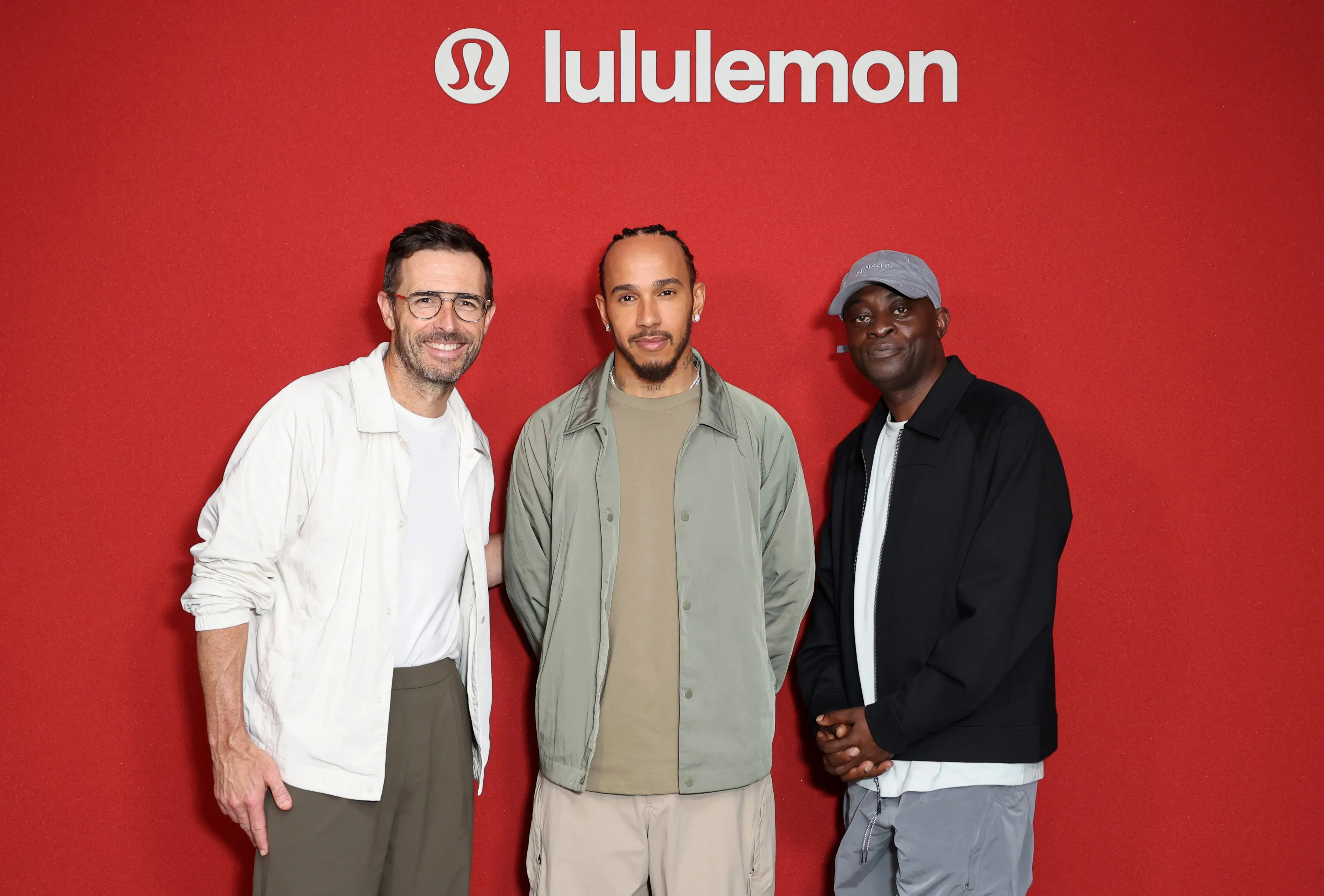 Lululemon CEO Calvin McDonald, Lewis Hamilton and Charlie Dark attend the Lululemon Media Event on July 01, 2025 in London, England.