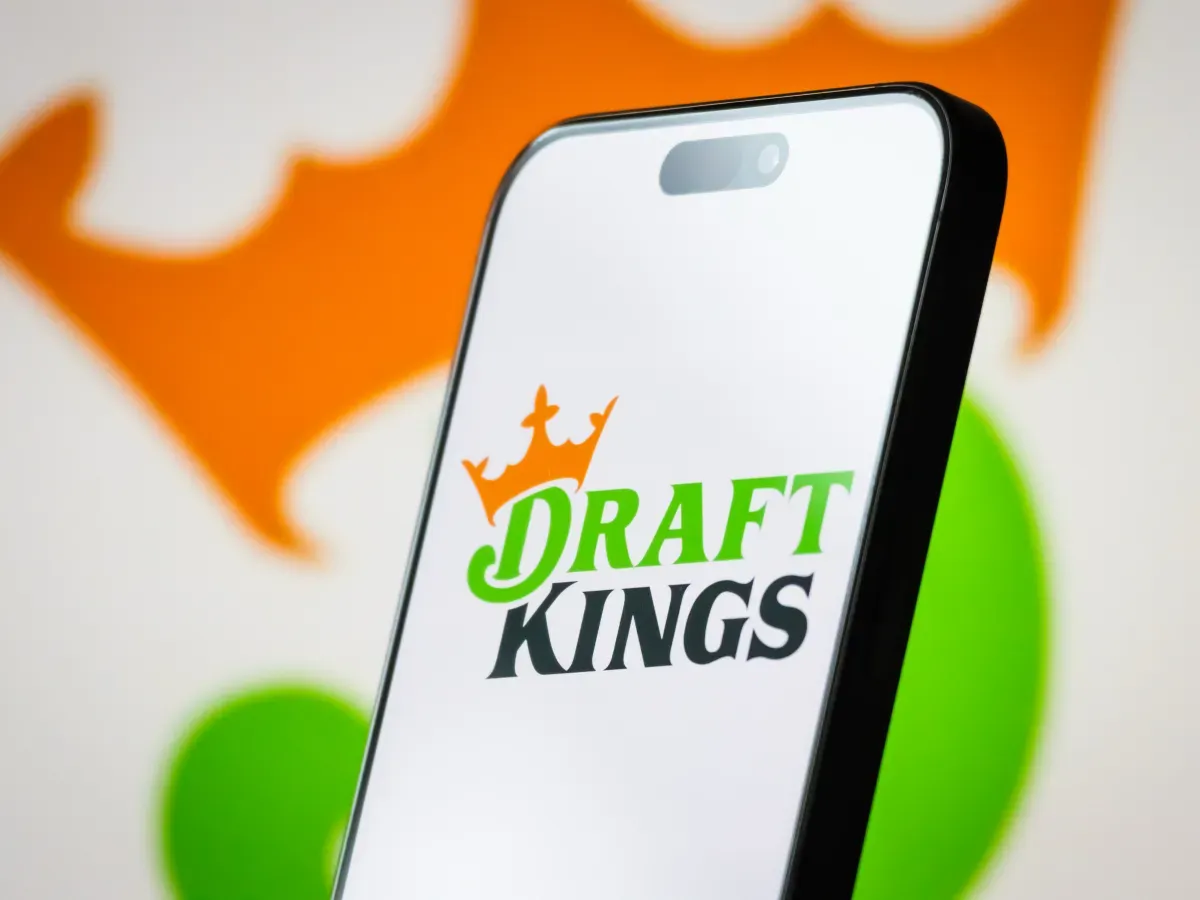 In this photo illustration, the logo of DraftKings Inc. is displayed on a smartphone screen. (Photo illustration by Cheng Xin/Getty Images)