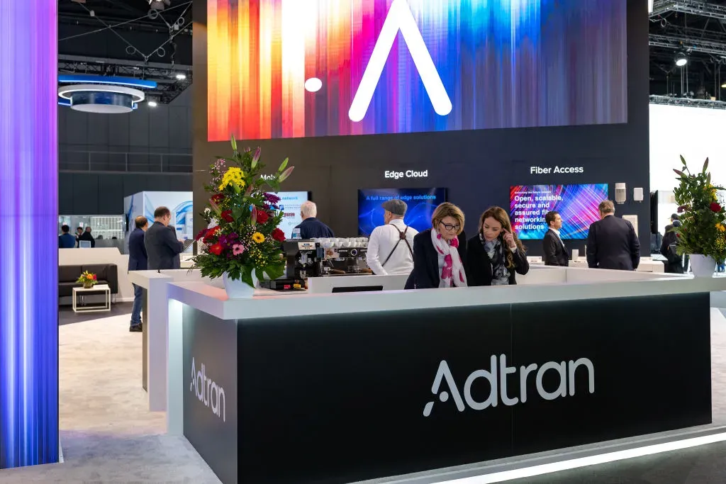 Visitors walk at the Adtran during the Mobile World Congress 2023 (MWC).