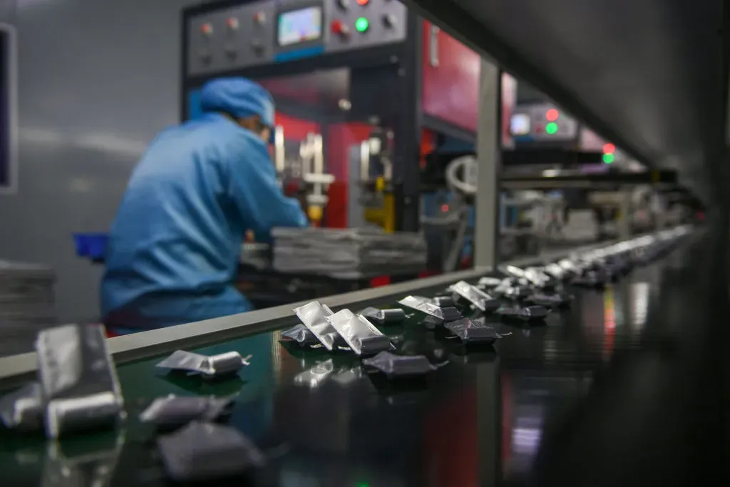 A worker is working on a lithium battery production line at Daoxian High-tech Industrial Development Zone in Yongzhou, China.