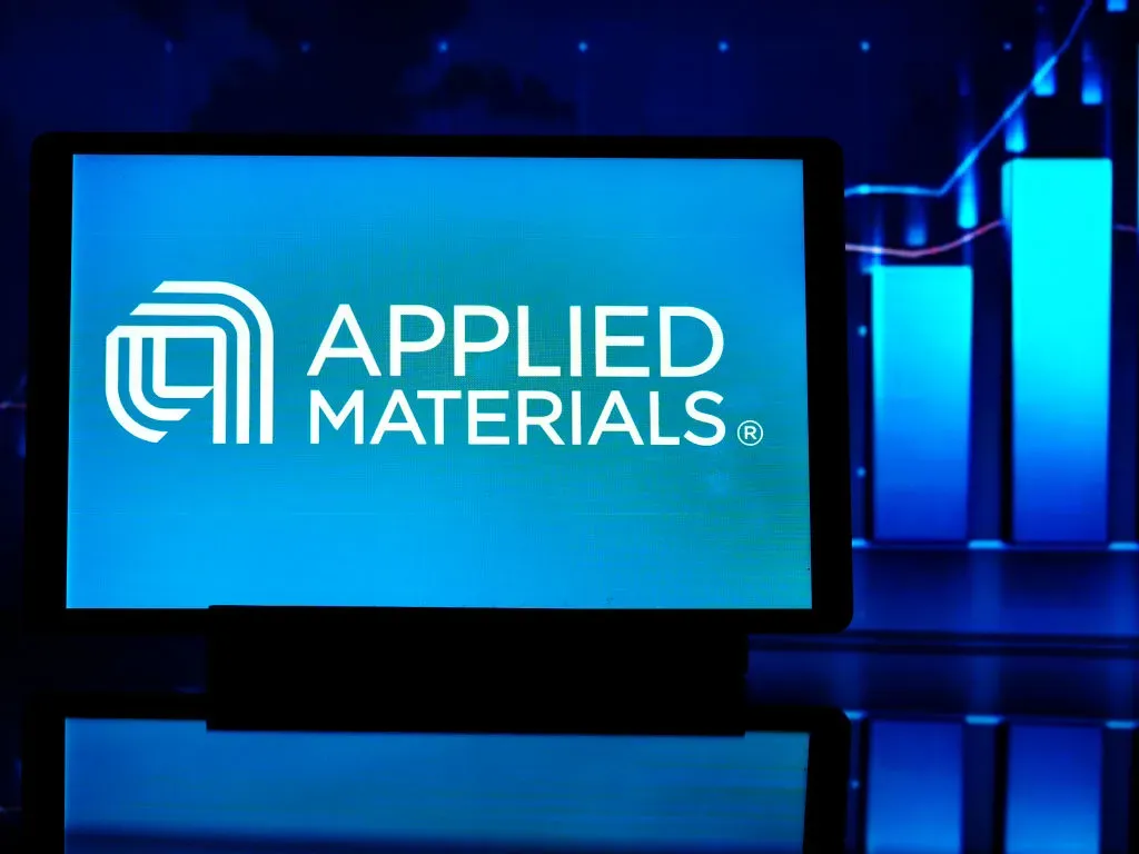 In this photo illustration, an Applied Materials, Inc logo seen displayed on a tablet.
