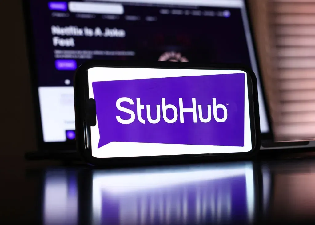 In this photo illustration, the StubHub logo and webpage are displayed on a cell phone and computer monitor.