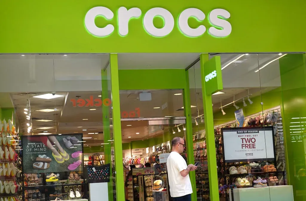 A shopper walks by a Crocs store at the Great Mall Milpitas on May 07, 2024 in Milpitas, California.