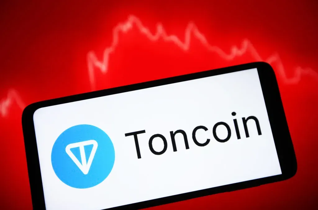 In this photo illustration, a Toncoin (TON) cryptocurrency logo is seen on a smartphone screen. 