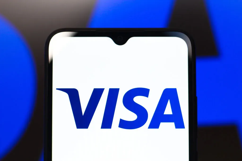 In this photo illustration, the Visa, Inc. logo is seen displayed on a smartphone screen.