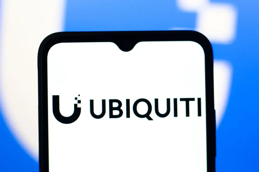 In this photo illustration, the Ubiquiti logo is seen displayed on a smartphone screen.