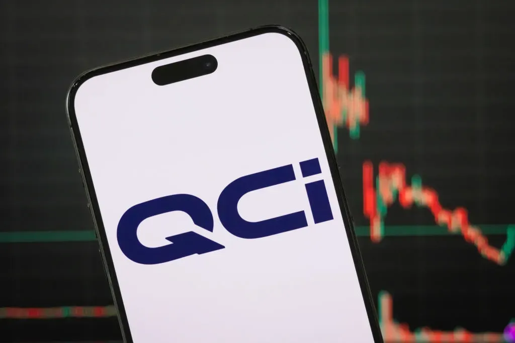 In this photo illustration, the Quantum Computing Inc. (QCi) logo is displayed on a smartphone screen.