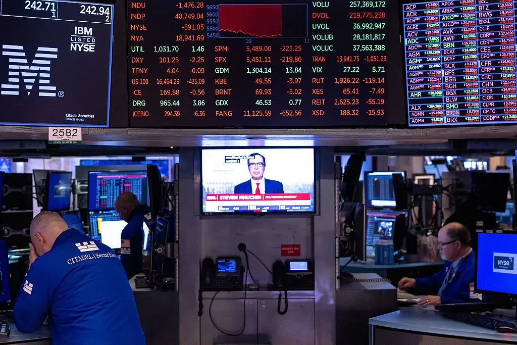 Traders work on the floor of the New York Stock Exchange.