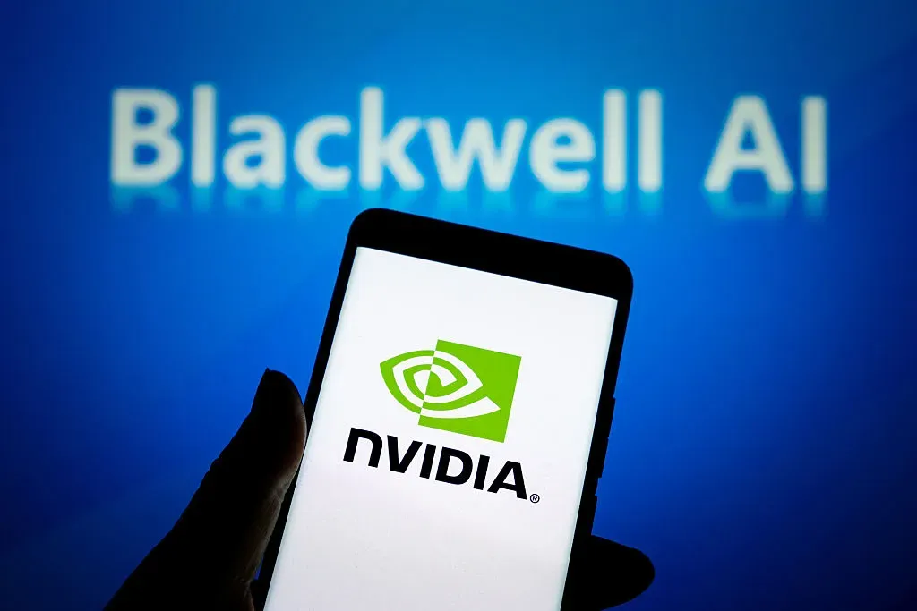 An illustration photo shows the NVIDIA LOGO displayed in a smartphone with the Blackwell AI logo in the background in Chongqing, China on June 11, 2025.