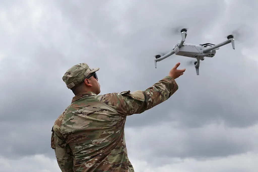 A soldier with the 101st Airborne 2-327 Multi-Purpose Company catches a drone in the Pentagon parking lot.