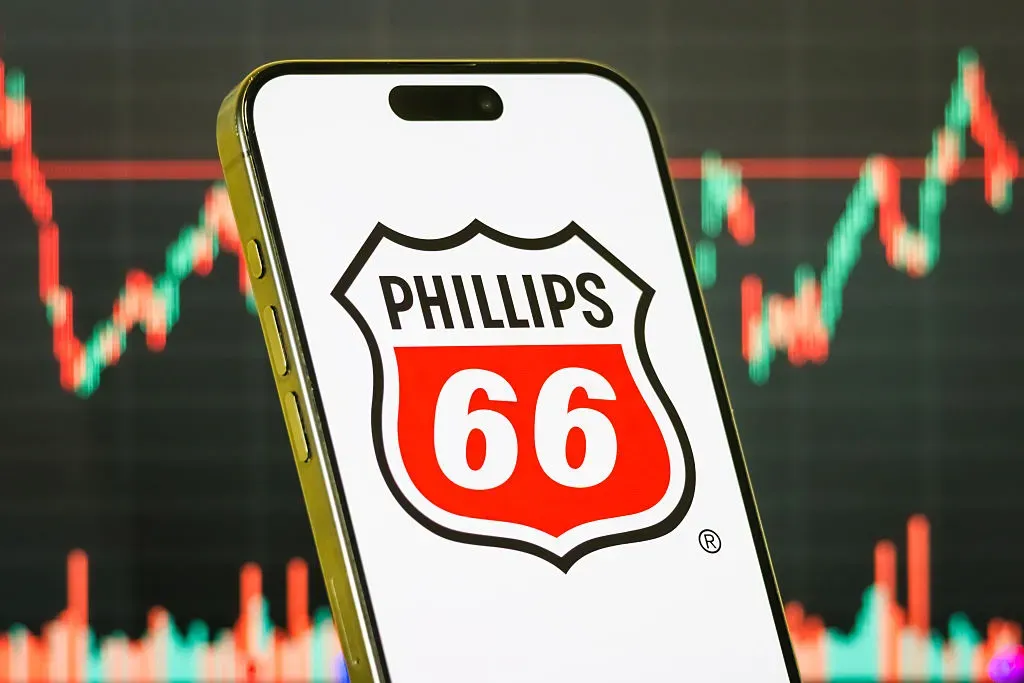 In this photo illustration, a smartphone displays the logo of Phillips 66 (NYSE: PSX), an American multinational energy company.