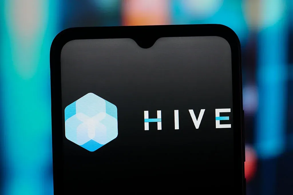 In this photo illustration, the HIVE Digital Technologies logo is seen displayed on a smartphone screen. 