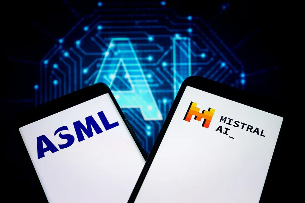 An illustration photo shows ASML and Mistral AI logo in a smartphone.