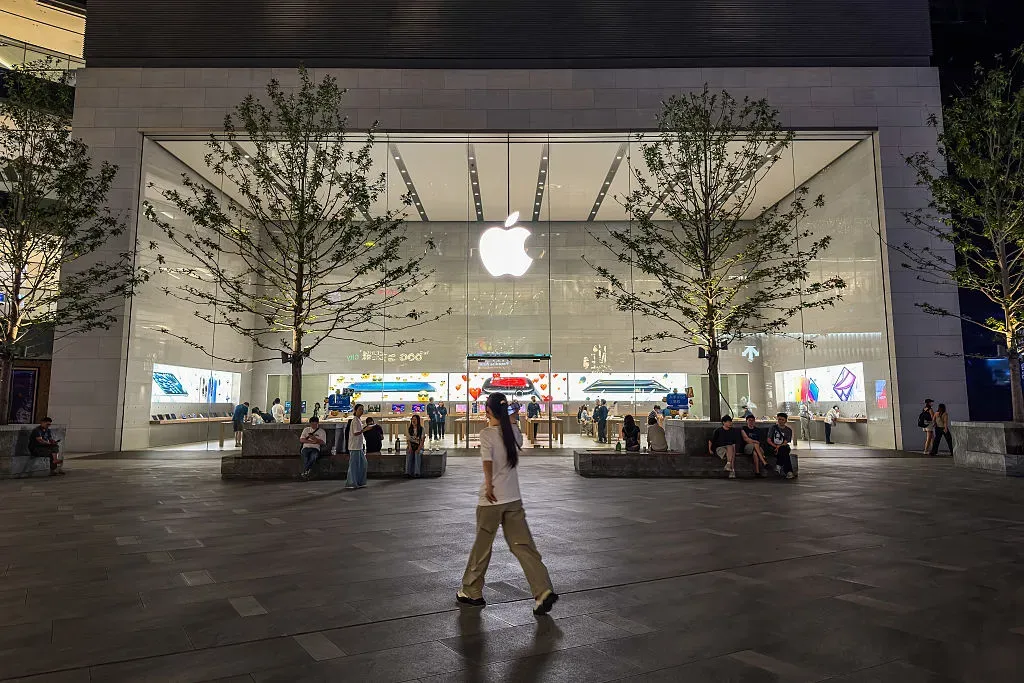 A pedestrian walks past an Apple retail store on September 9, 2025.