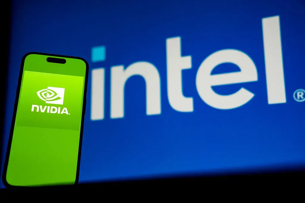In this photo illustration, logo of Nvidia is displayed on a mobile phone screen in front of a screen displaying the logo of intel in Ankara, Turkiye on September 29, 2025.