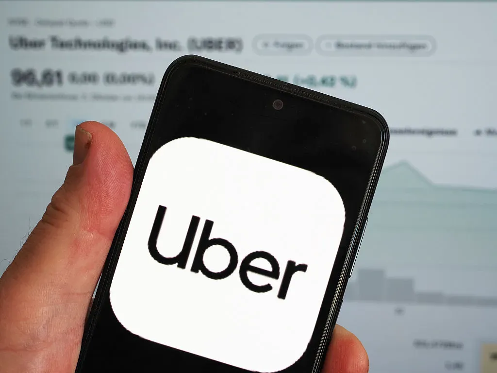 In this photo illustration, the Uber Technologies Inc logo is seen displayed on a smartphone screen. 