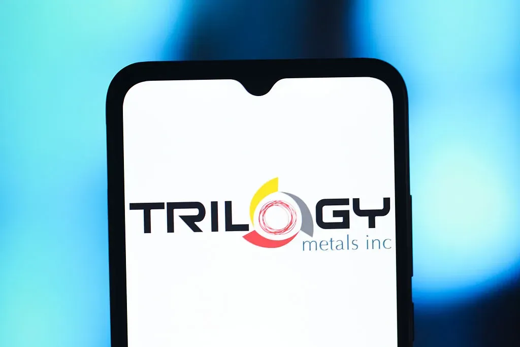  In this photo illustration, the Trilogy Metals logo is seen displayed on a smartphone screen. 