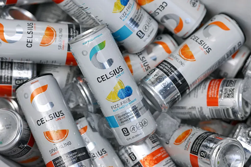 A detail view of cans of Celsius, a sparkling energy drink, on ice before a game.