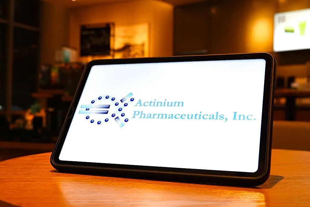 In this photo illustration, the Actinium Pharmaceuticals, Inc. logo is displayed on the screen of a tablet.