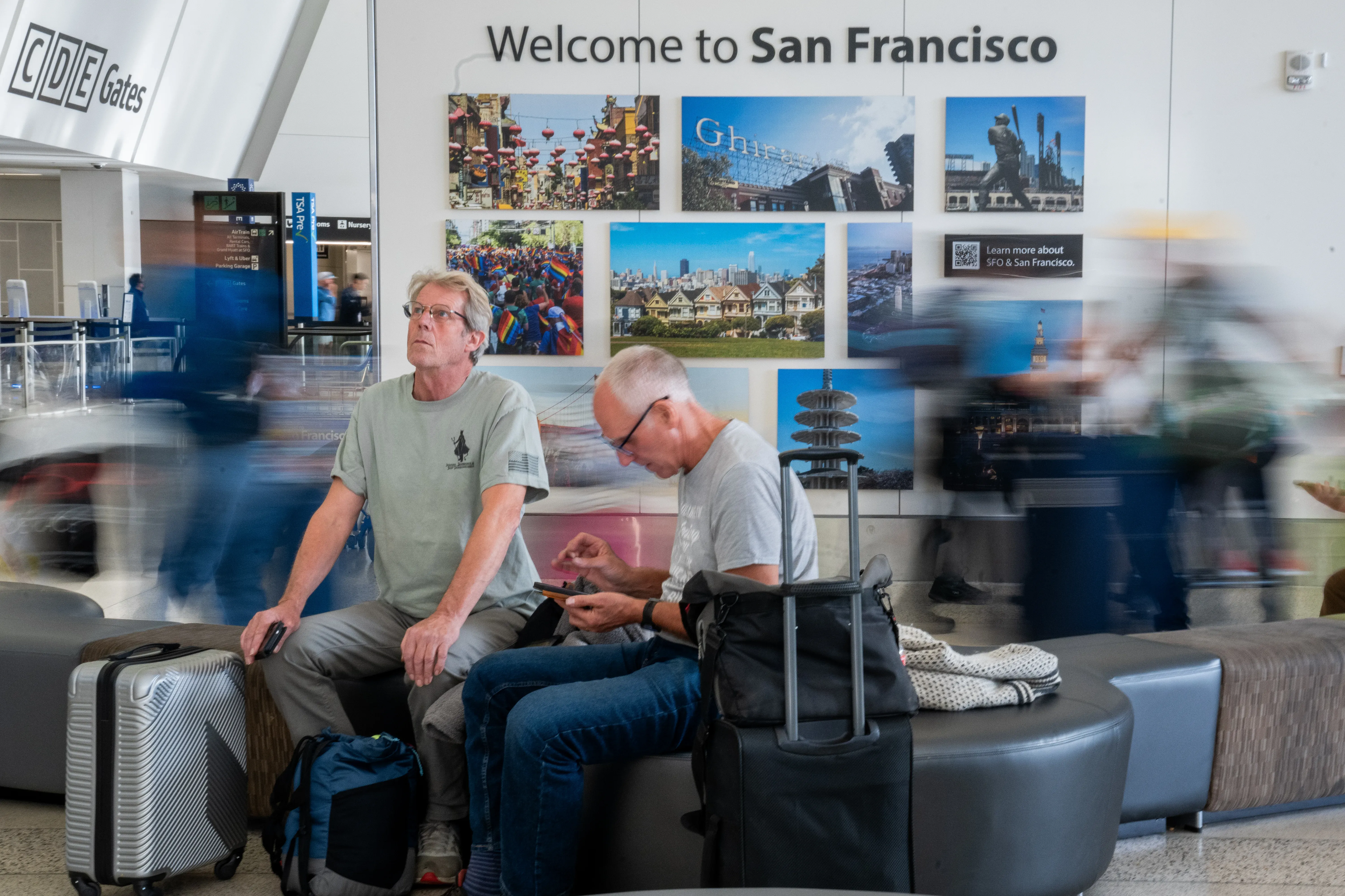 Passengers wait at the hall of San Francisco International Airport on November 10, 2025 in San Francisco, California.