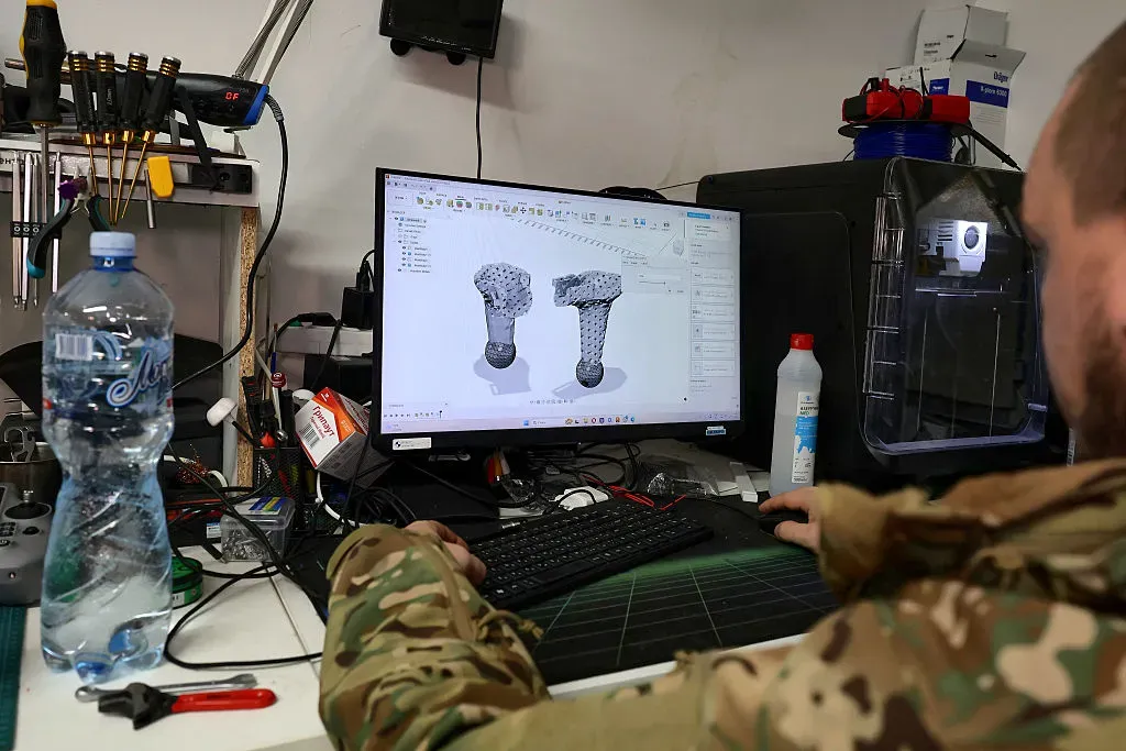 A specialist uses 3D printing software in the UAV workshop of an operational battalion of the 13th Khartiia Brigade of Ukraine's National Guard in Kharkiv region.