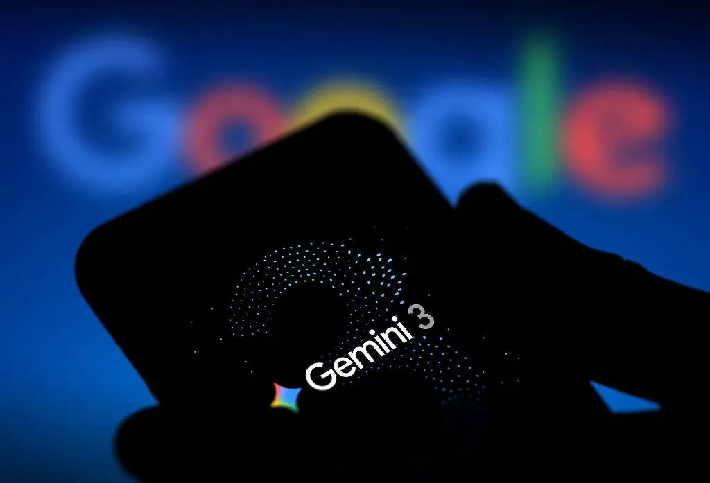 In this photo illustration, the logo of Gemini 3 is displayed on a smartphone screen with Google logo in the background.