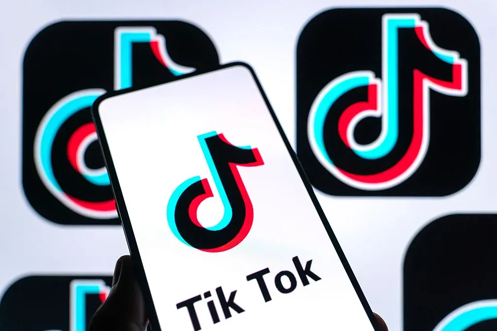 In this photo illustration, the logo of TikTok is displayed on a smartphone screen.
