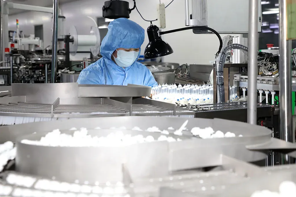 A worker produces medical instrument at Shandong Yixing Medical Instrument Co., Ltd.