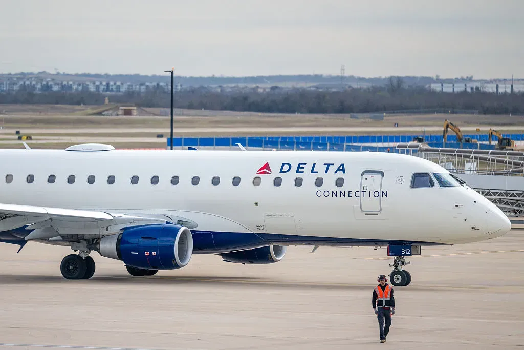 A Delta Airlines plane sits on the tarmac at the Austin-Bergstrom International Airport.