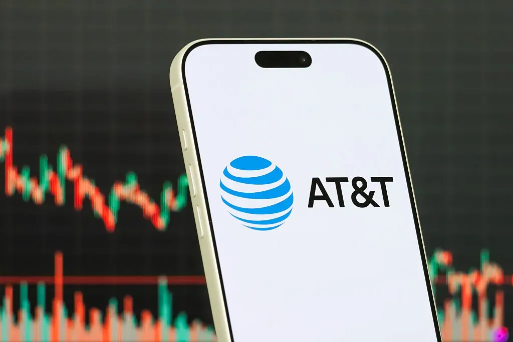 In this photo illustration, a smartphone displays the logo of AT&T Inc. 