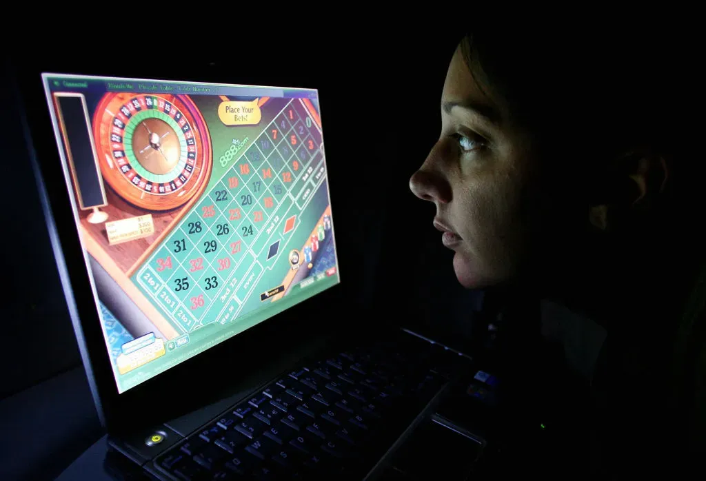 A woman uses an internet gambling website to play online roulette. 