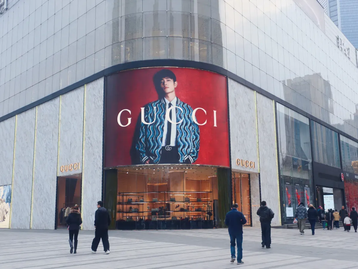 Pedestrians pass a store of Italian luxury brand Gucci in Shanghai, China, on February 4, 2025. (Photo by Costfoto/NurPhoto via Getty Images)