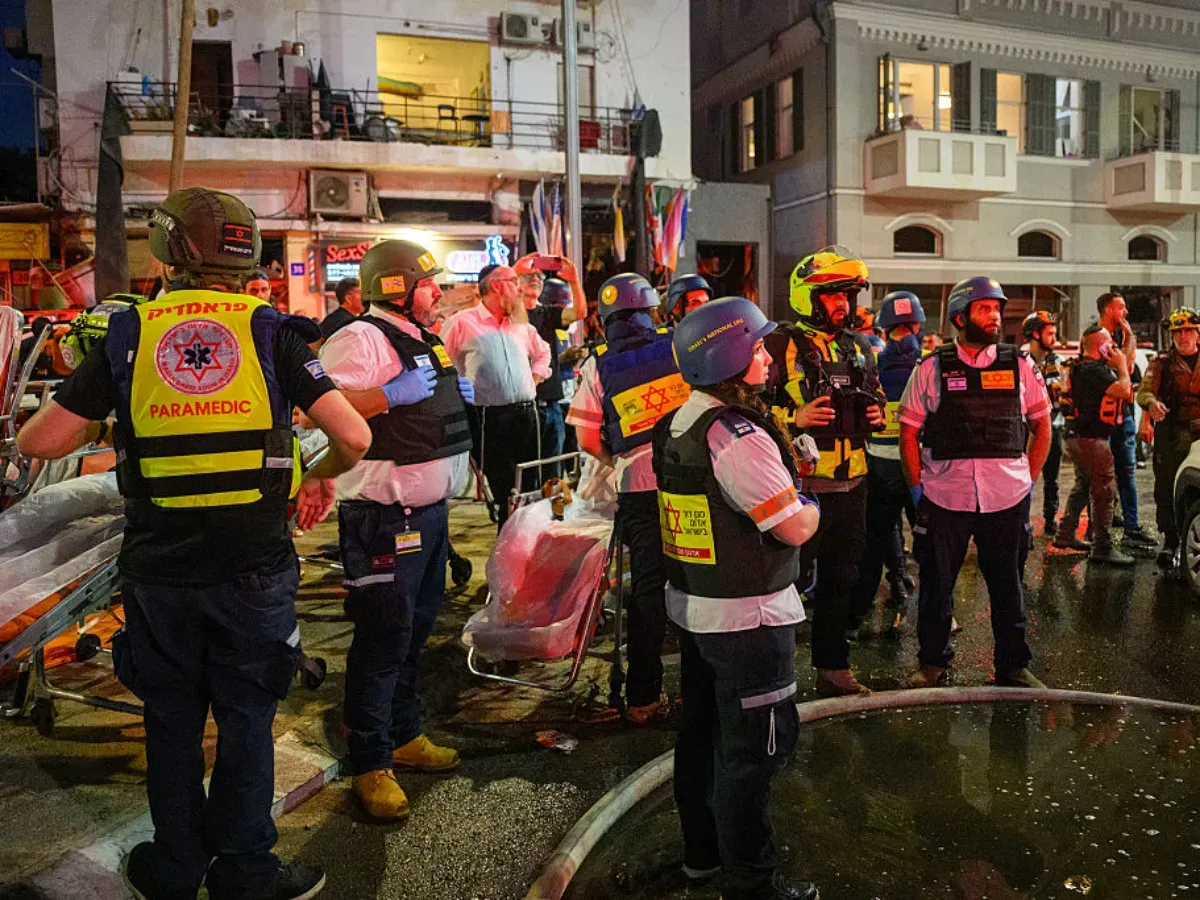 Israeli rescue workers and security personnel inspect and clear the buildings and area hit by an Iranian rocket on June 16, 2025 in Central Tel Aviv, Israel. on June 16, 2025 in Tel Aviv, Israel. 