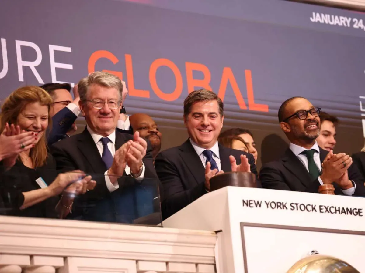 Co-founders of Venture Global Bob Pender (L) and Mike Sabel (C) celebrate after ringing the opening bell at the New York Stock Exchange on January 24, 2025.