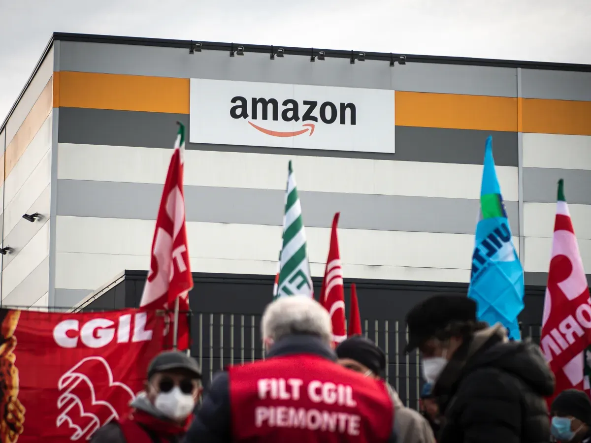 Amazon's logo is seen outside a distribution centre during a demonstration for better working conditions in front of the Amazon distribution centre in Brandizzo, Italy. (Photo by Nicolò Campo/LightRocket via Getty Images)
