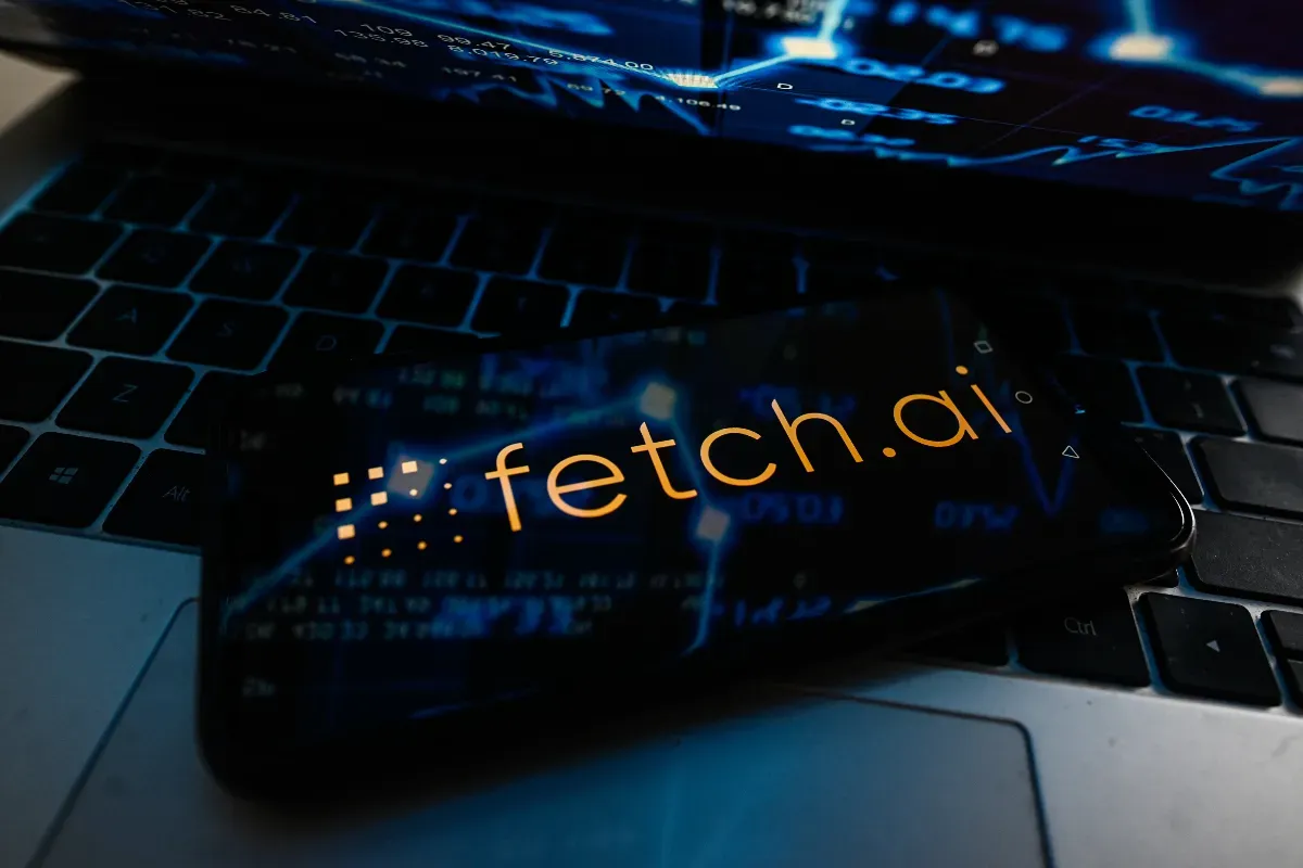 n this photo illustration, a Fetch.ai logo seen displayed on a smartphone on top of a laptop keyboard. (Photo Illustration by Omar Marques/SOPA Images/LightRocket via Getty Images)