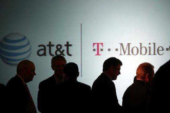 Executives at AT&T attend a news conference in New York City. (Photo by Spencer Platt/Getty Images)