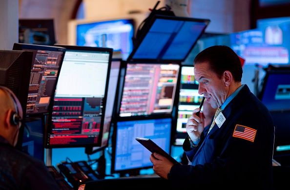 Traders work before the closing bell at the New York Stock Exchange (NYSE) (Photo credit should read JOHANNES EISELE/AFP via Getty Images)