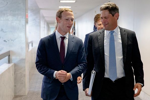 Meta founder and CEO Mark Zuckerberg and Vice President of Global Public Policy, Joel Kaplan (R) chat after leaving a meeting with Senator John Cornyn (R-TX) in his office on Capitol Hill. (Photo by Samuel Corum/Getty Images)