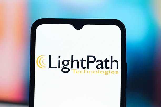 In this photo illustration, the LightPath Technologies (Light Path) logo is seen displayed on a smartphone screen. (Photo Illustration by Thomas Fuller/SOPA Images/LightRocket via Getty Images)