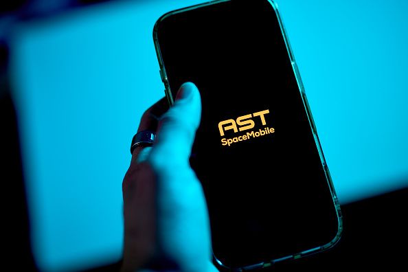 The AST SpaceMobile Inc. logo arranged on a smartphone in Forest Hills, New York, US, on Saturday, April 11, 2026. AST has a market value of $25 billion despite annual revenue of $71 million, with a community of investors called the SpaceMob who enthusiastically support the stock. Photographer: Gabby Jones/Bloomberg via Getty Images