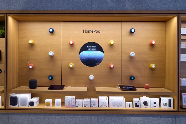 The HomePod display wall at the Apple Store at Piazza Liberty is seen in Milan, Italy, on April 3, 2026. The wooden display features multiple HomePod mini units in various colors, a circular screen showing audio promotional content reading ''Bassi ricchi e profondi'' (Rich and deep bass), and a range of third-party smart home accessories from brands including Nanoleaf and Eve. (Photo by Matteo Della Torre/NurPhoto via Getty Images)