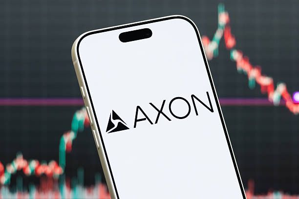 Axon Enterprise Logo Shown on Smartphone with Latest Stock Market Chart