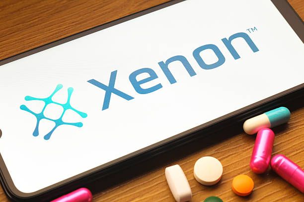 In this photo illustration, the Xenon Pharmaceuticals logo is seen displayed on a smartphone screen. (Photo Illustration by Thomas Fuller/SOPA Images/LightRocket via Getty Images)