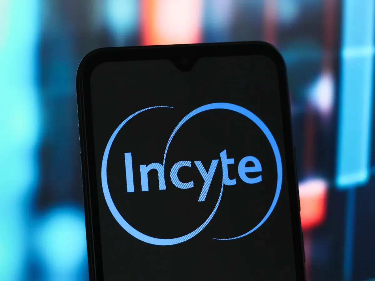 In this photo illustration, the Incyte Corporation logo is seen displayed on a smartphone screen. (Photo Illustration by Thomas Fuller/SOPA Images/LightRocket via Getty Images)