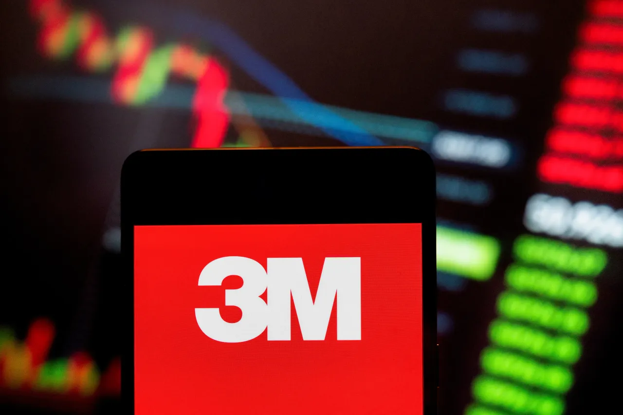 n this photo illustration, the American company specializing in worker safety, U.S. health care, and consumer goods, 3M (NYSE: MMM), logo seen displayed on a smartphone.