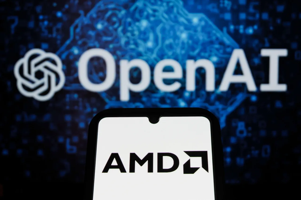 In this photo illustration, the AMD logo is displayed on a smartphone with an OpenAI logo in the background. 