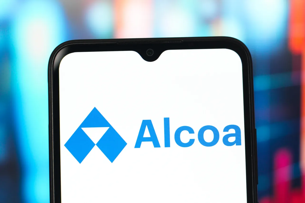 In this photo illustration, the Alcoa logo is seen displayed on a smartphone screen.