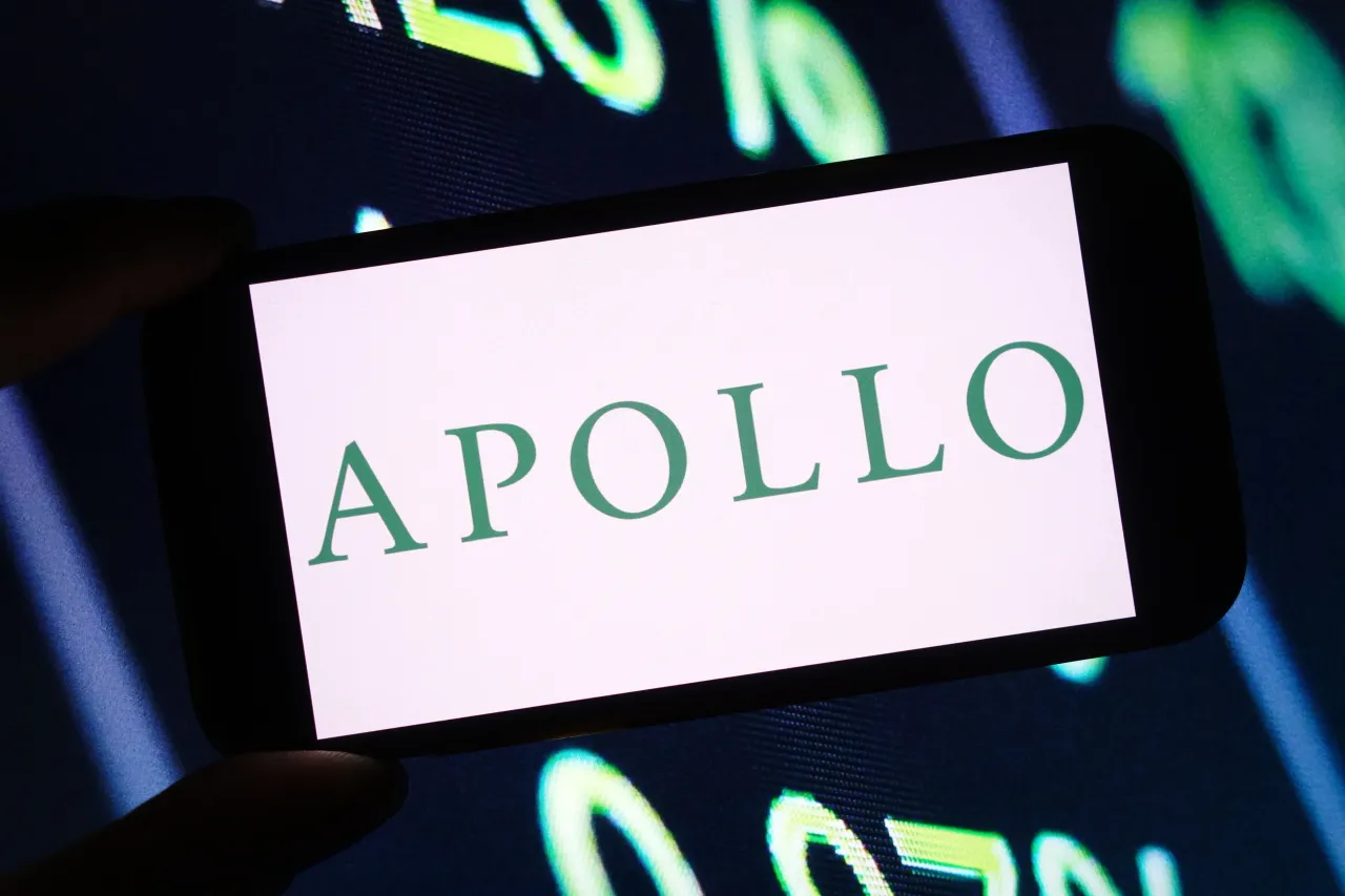  In this photo illustration, the Apollo Global Management company logo is seen displayed on a smartphone screen.