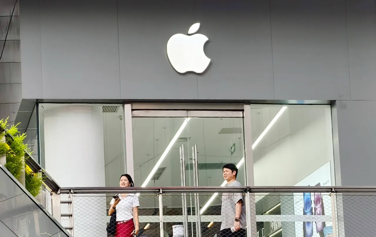 onsumers pass by Apple's new iPhone store in Shanghai, China, on July 14, 2025. 
